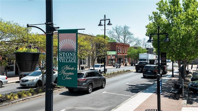 842 Third St, Stone Mountain, GA 30083 - view of asphalt road featuring sidewalks, street lighting, and curbs