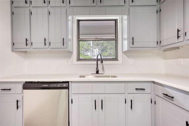 2931 Randolph Ct, Conyers, GA 30012 - kitchen featuring dishwasher, a sink, decorative backsplash, and light countertops