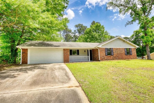 2931 Randolph Ct, Conyers, GA 30012 - ranch-style house with a garage, driveway, brick siding, and a front yard