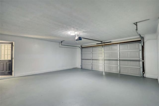 2931 Randolph Ct, Conyers, GA 30012 - garage featuring a garage door opener and baseboards