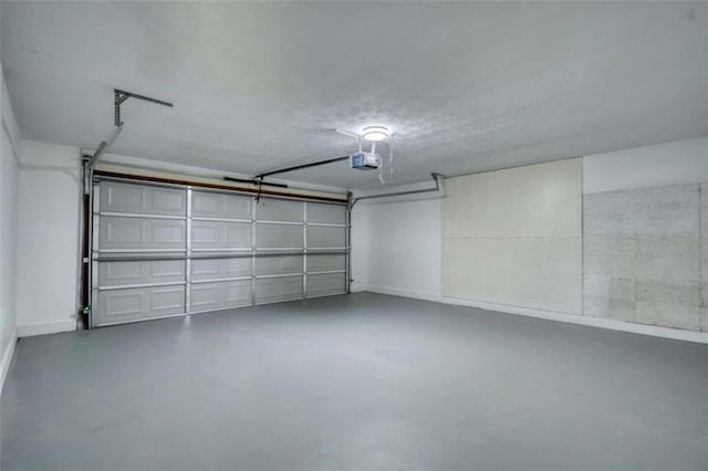 2931 Randolph Ct, Conyers, GA 30012 - garage featuring a garage door opener and baseboards