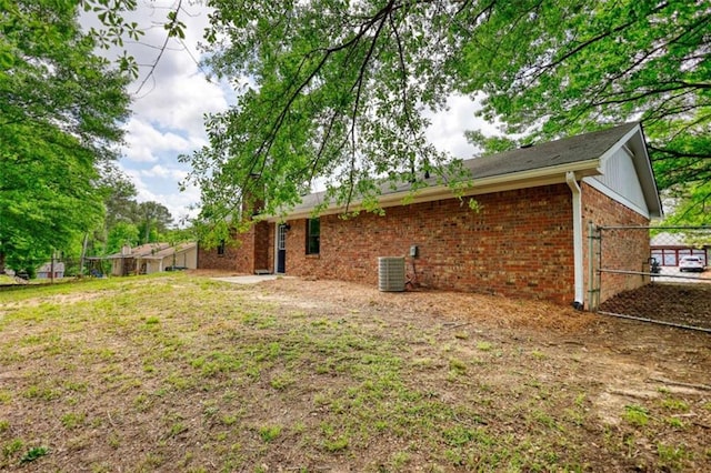2931 Randolph Ct, Conyers, GA 30012 - rear view of property with brick siding and central AC unit