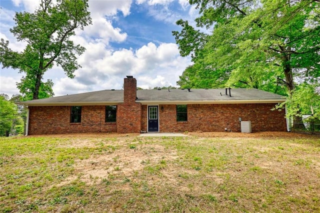 2931 Randolph Ct, Conyers, GA 30012 - back of property featuring a chimney, cooling unit, and brick siding