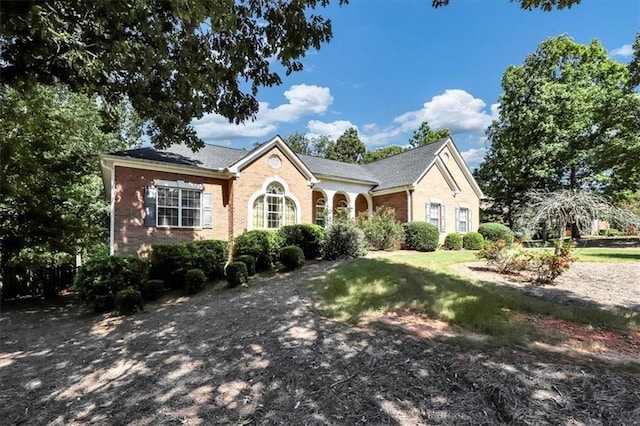 view of front of home featuring brick siding