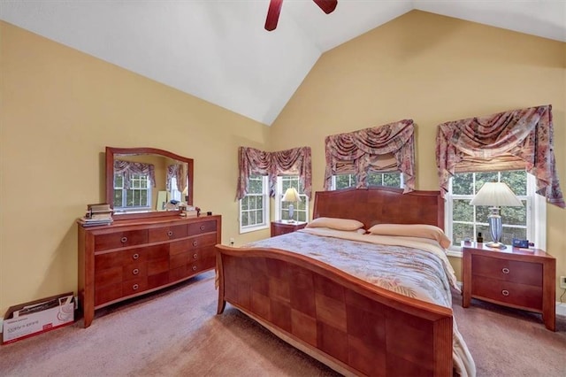 bedroom featuring carpet floors, high vaulted ceiling, and ceiling fan