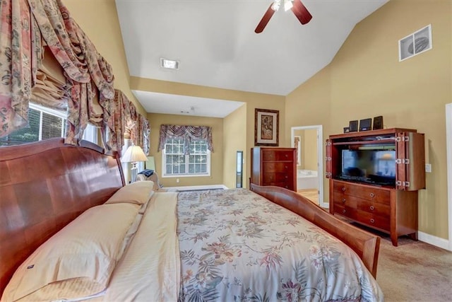 carpeted bedroom featuring visible vents, connected bathroom, ceiling fan, baseboards, and high vaulted ceiling