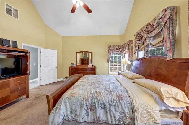 bedroom with visible vents, baseboards, ceiling fan, carpet, and high vaulted ceiling