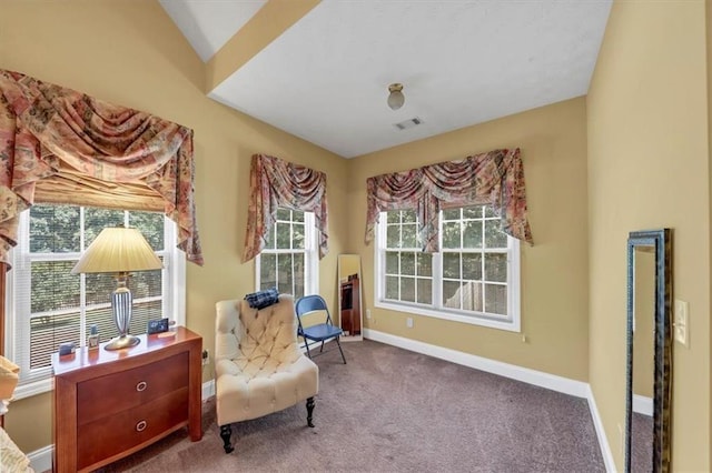 sitting room featuring visible vents, baseboards, and carpet