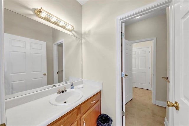 bathroom featuring baseboards and vanity