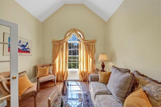 living area featuring french doors and high vaulted ceiling