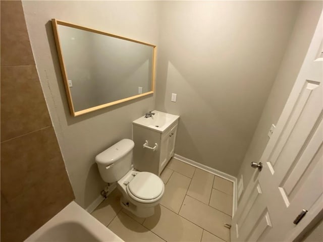 bathroom with vanity, tile patterned floors, and toilet