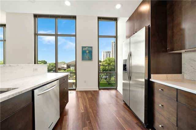 905 Juniper St NE Unit 805, Atlanta, GA 30309 - kitchen with appliances with stainless steel finishes, floor to ceiling windows, dark wood-type flooring, plenty of natural light, and recessed lighting