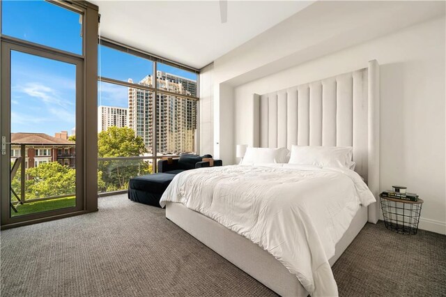905 Juniper St NE Unit 805, Atlanta, GA 30309 - carpeted bedroom featuring floor to ceiling windows and a view of city