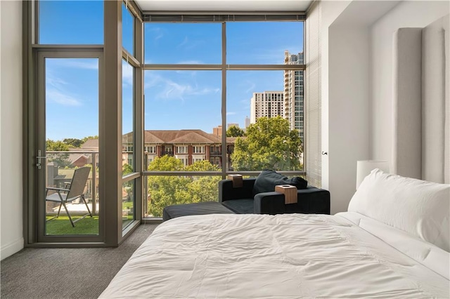 905 Juniper St NE Unit 805, Atlanta, GA 30309 - bedroom with floor to ceiling windows, carpet, multiple windows, and access to exterior