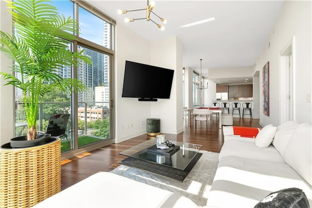 905 Juniper St NE Unit 805, Atlanta, GA 30309 - living area featuring a chandelier and wood finished floors