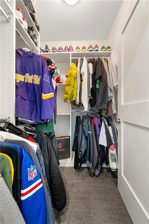 905 Juniper St NE Unit 805, Atlanta, GA 30309 - walk in closet featuring carpet