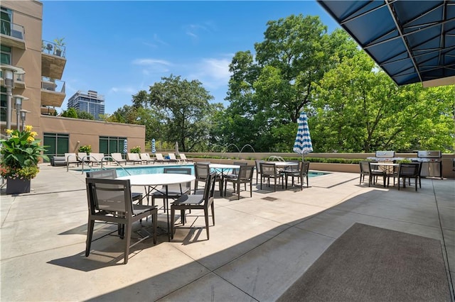 905 Juniper St NE Unit 805, Atlanta, GA 30309 - view of patio / terrace with outdoor dining area and a community pool
