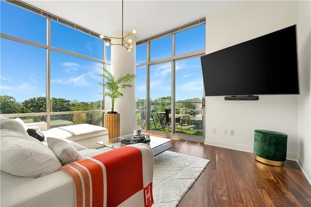 905 Juniper St NE Unit 805, Atlanta, GA 30309 - living area featuring dark wood finished floors and a wall of windows