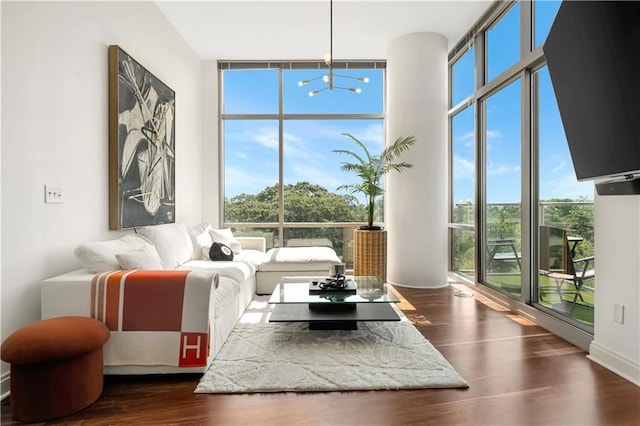 905 Juniper St NE Unit 805, Atlanta, GA 30309 - living room with floor to ceiling windows, a chandelier, and dark wood finished floors