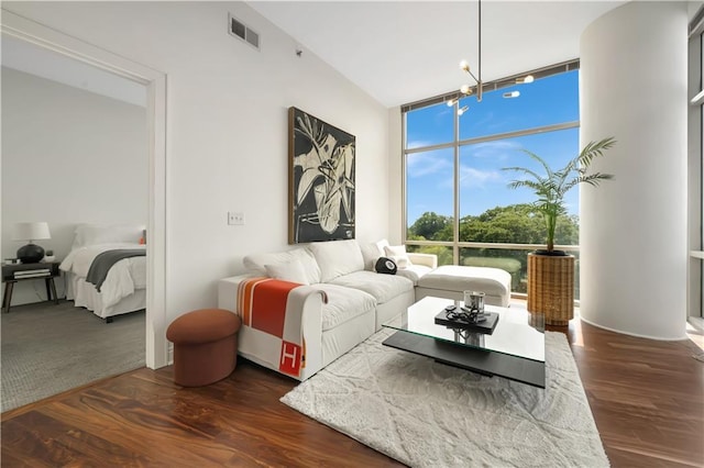 905 Juniper St NE Unit 805, Atlanta, GA 30309 - living area featuring floor to ceiling windows and dark wood finished floors