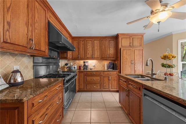 kitchen with sink, range with two ovens, dark stone countertops, black dishwasher, and range hood