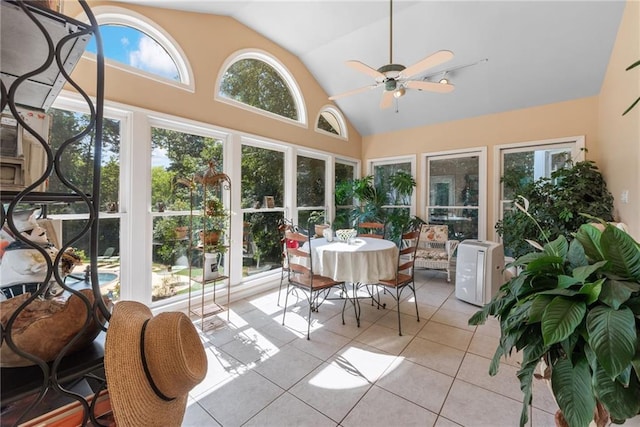 sunroom featuring ceiling fan and vaulted ceiling