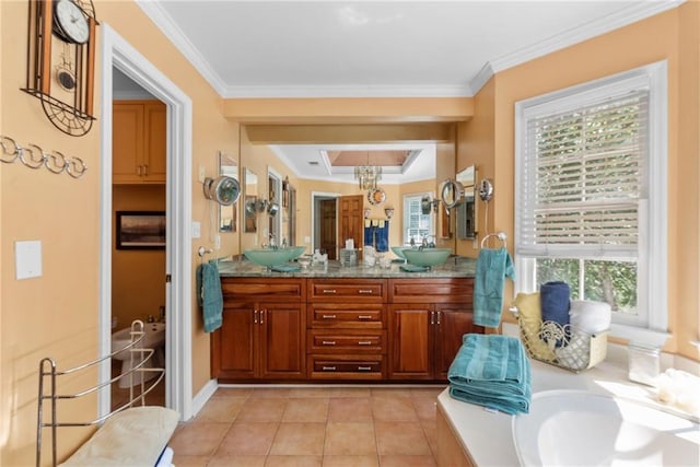 bathroom featuring tile patterned floors, crown molding, vanity, and a healthy amount of sunlight