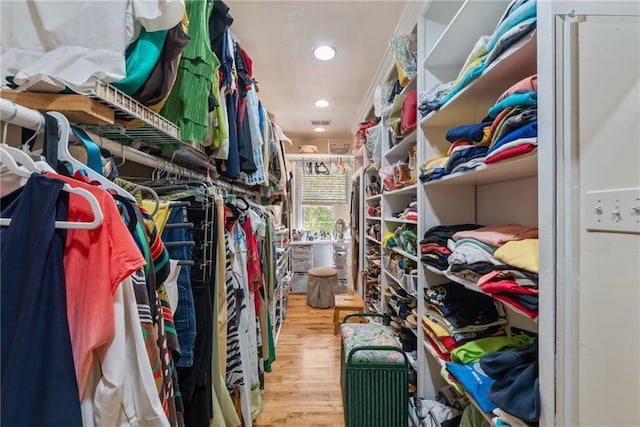 spacious closet featuring hardwood / wood-style floors