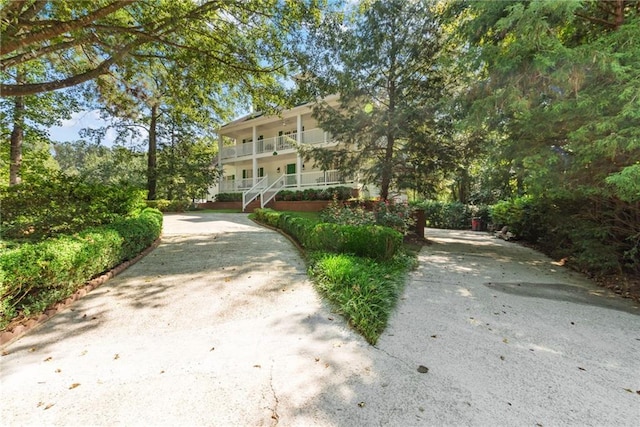 exterior space featuring a porch and a balcony