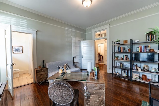 sitting room featuring dark hardwood / wood-style flooring and crown molding