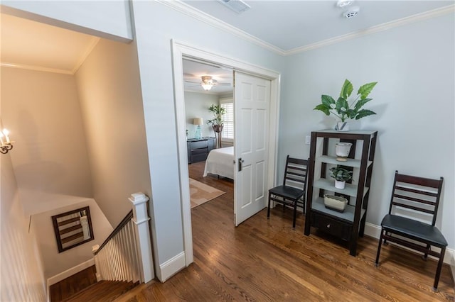 interior space featuring hardwood / wood-style flooring and crown molding