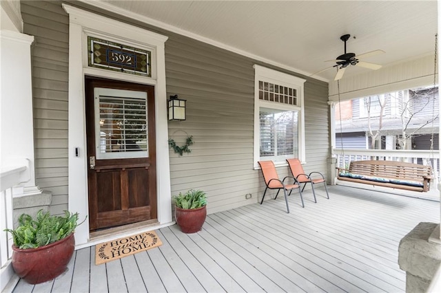 exterior space with covered porch and ceiling fan