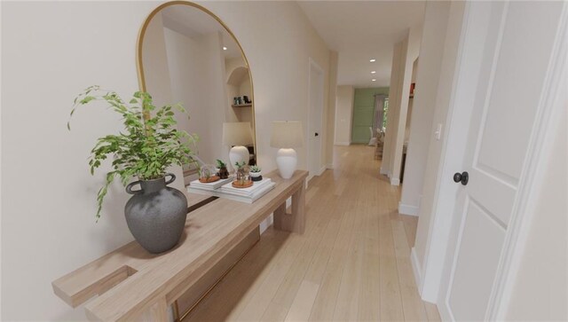 hallway with light hardwood / wood-style flooring