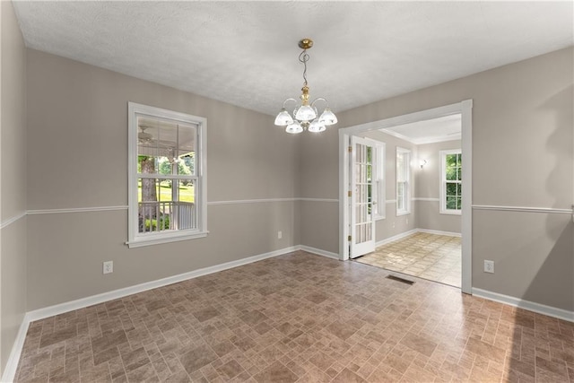 241 Cook St, Alto, GA 30510 - spare room featuring a chandelier and baseboards