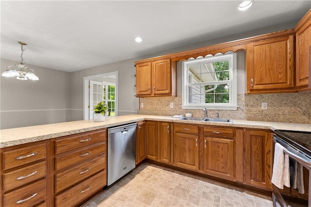 241 Cook St, Alto, GA 30510 - kitchen featuring stainless steel appliances, a sink, brown cabinets, healthy amount of natural light, and recessed lighting