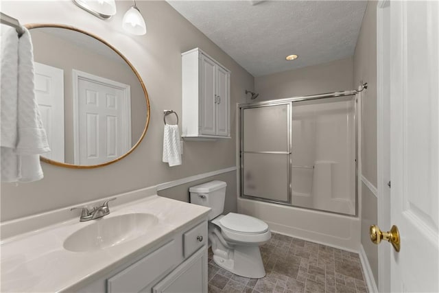 241 Cook St, Alto, GA 30510 - bathroom featuring vanity, toilet, enclosed tub / shower combo, and a textured ceiling