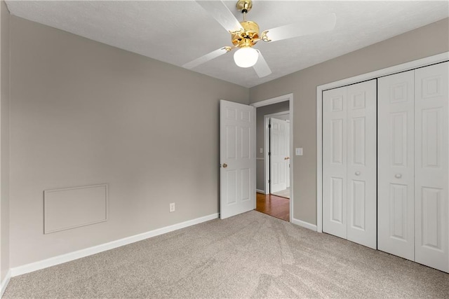 241 Cook St, Alto, GA 30510 - unfurnished bedroom featuring carpet, baseboards, a closet, and a ceiling fan