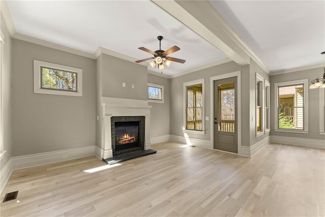 unfurnished living room featuring visible vents, a glass covered fireplace, ceiling fan with notable chandelier, and light wood-style floors