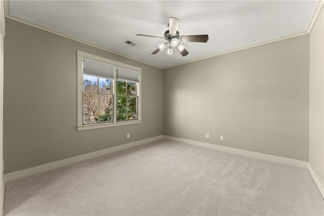 unfurnished room featuring crown molding, ceiling fan, carpet flooring, and visible vents
