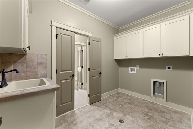 laundry room with electric dryer hookup, cabinet space, a sink, hookup for a washing machine, and ornamental molding