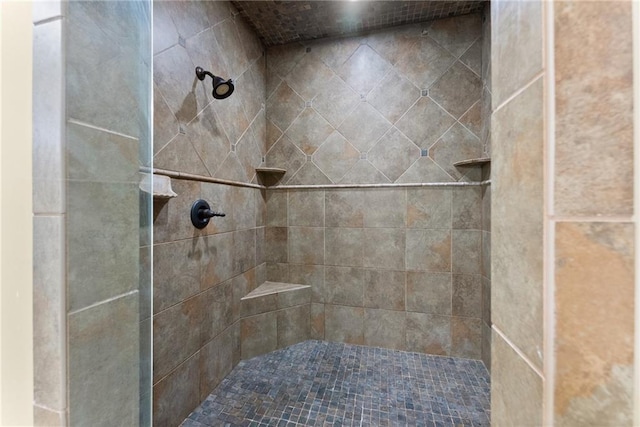 full bath featuring a tile shower