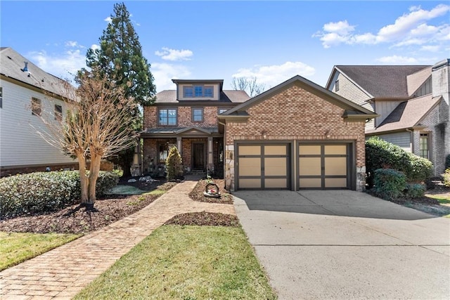 view of front of property featuring stone siding, brick siding, an attached garage, driveway, and a porch