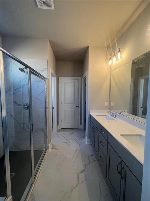 bathroom featuring vanity and an enclosed shower