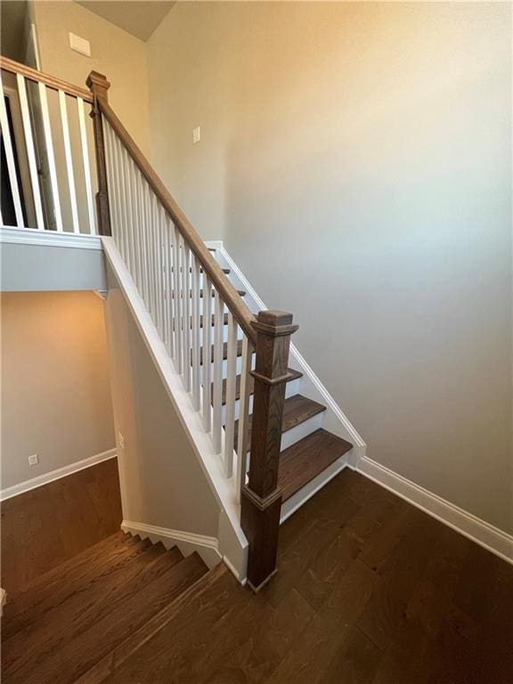 stairway featuring hardwood / wood-style flooring