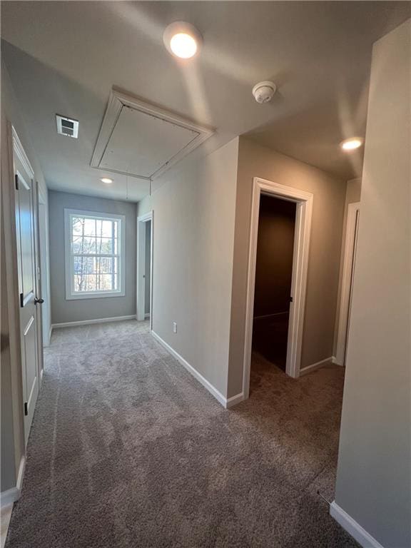 empty room featuring dark colored carpet