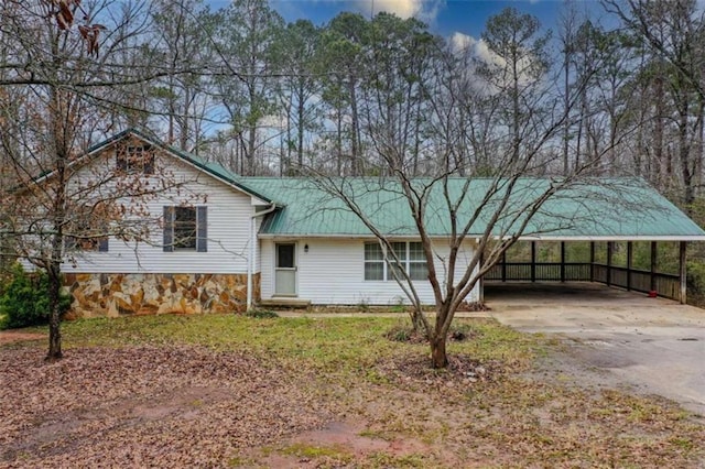 view of front of home with a carport