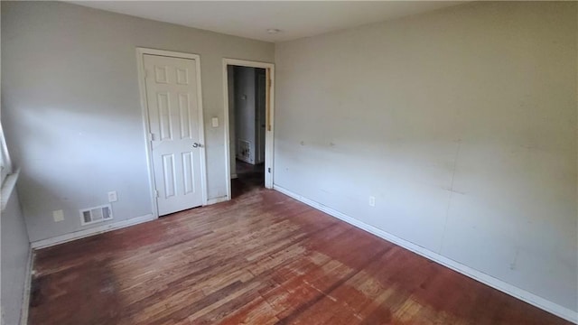 unfurnished bedroom with wood-type flooring