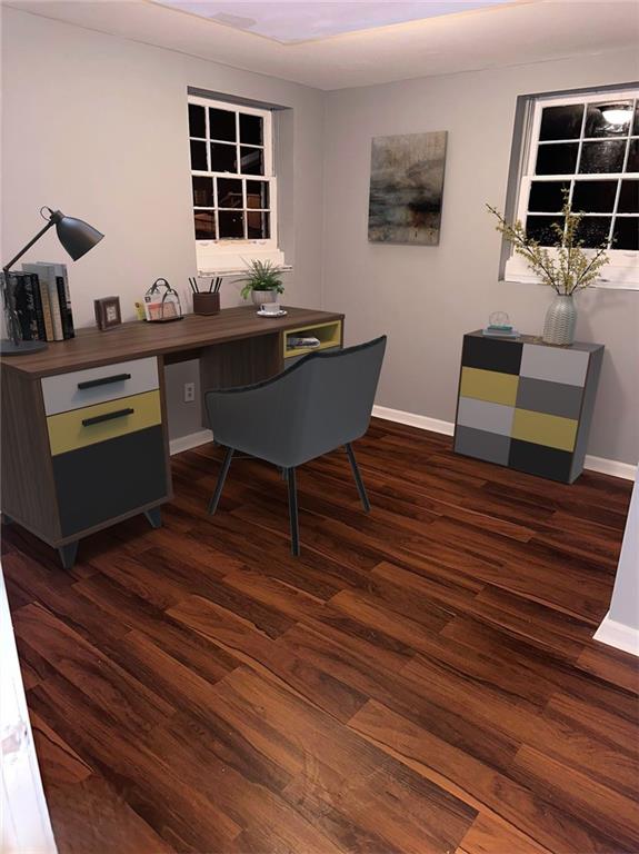 office area with baseboards and dark wood-style flooring