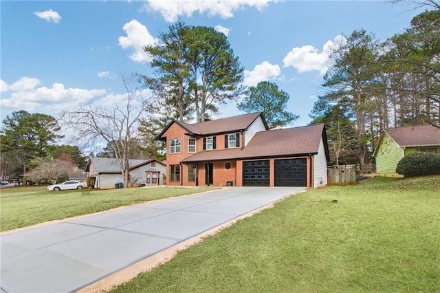 view of front of home with a front yard and a garage