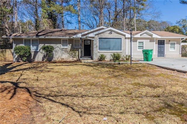 ranch-style house featuring crawl space, fence, a front lawn, and brick siding